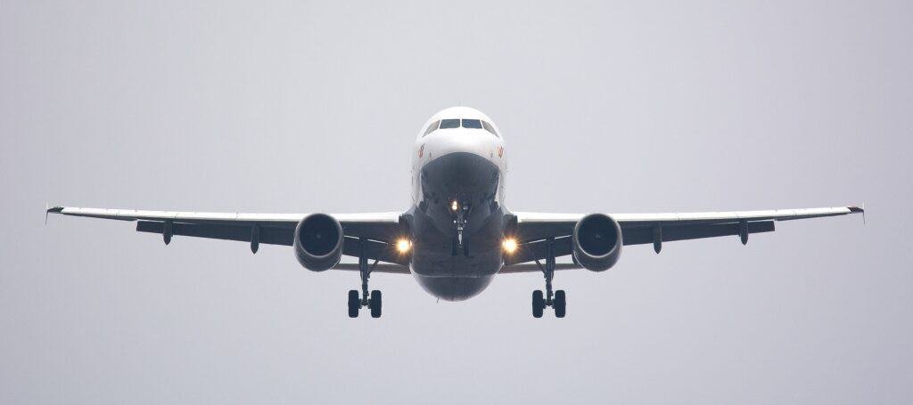 Essential travel health advice across international borders 3 A Boeing passenger jet in the process of arriving at the airport from an international travel