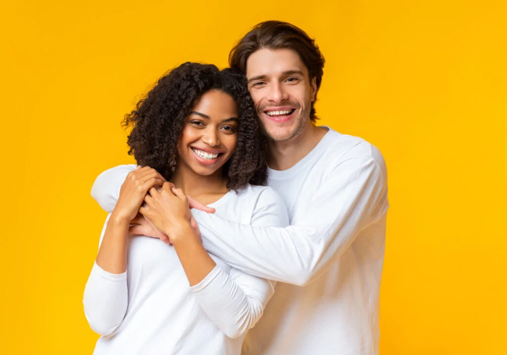 A multiracial couple who are happy that they are meeting the emotional needs in a relationship.