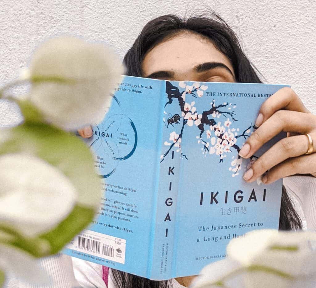 Ikigai: researchers reveal the secrets to a long and rewarding life now (with Video) 3 A lady reading the ikigai: the Japanese secret to a long and happy life book