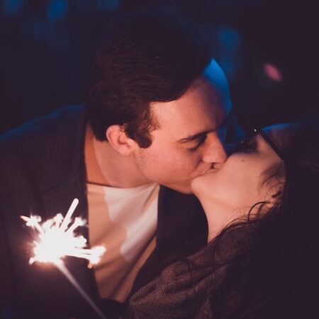 A couple kissing under dazzling light as a sign of their romance in marriage