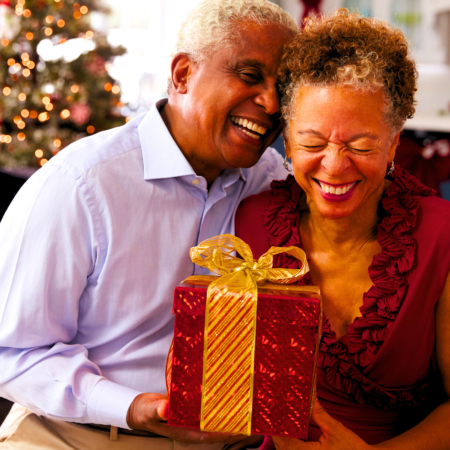 A Black couple celebrating their 40th wedding anniversary speaking their gift giving love language.